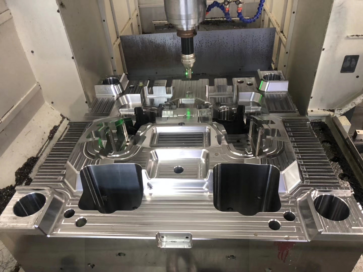 Machined mold cavities and openings